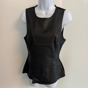 Faux leather front sleeveless top. Back has full length zipper.